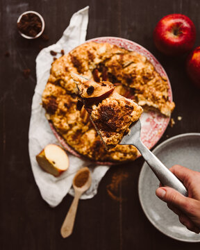 Top view of apple galette with raisins and cream
