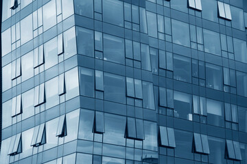 angle view. backdrop of Modern office blue glass building. perspective wide angle view to steel ...