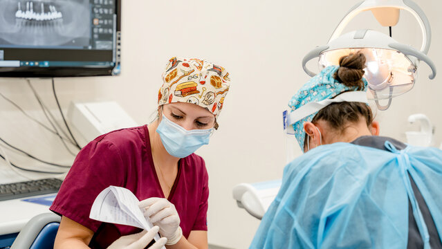 Dental clinic team preparing for implant procedure
