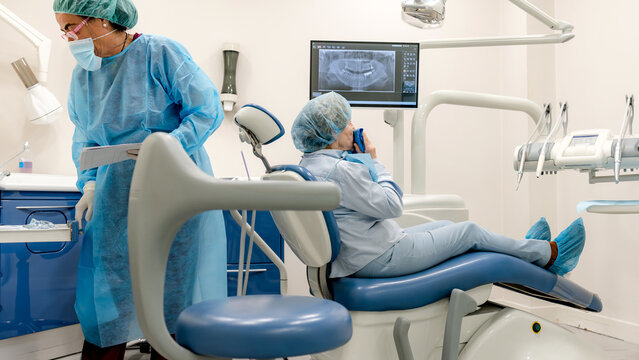 Dental professional with patient in modern clinic setting