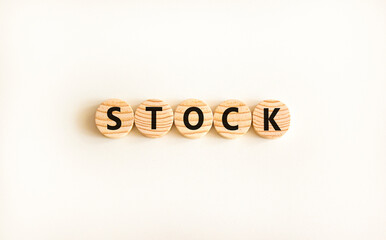 Stock symbol. Concept word Stock on beautiful wooden circles. Beautiful white table white background. Business lifestyle stock concept. Copy space.