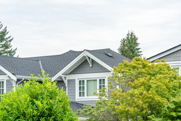 Top of luxury house with shingle roof and nice windows in Summer in Vancouver, Canada, North America. Day time on August 2025.