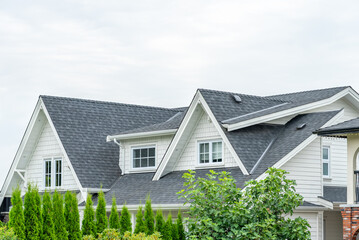 Top of luxury house with shingle roof and nice windows in Summer in Vancouver, Canada, North America. Day time on August 2025.