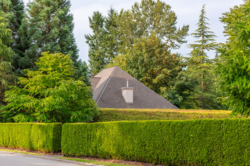 Top of luxury house with shingle roof and nice windows in Summer in Vancouver, Canada, North...