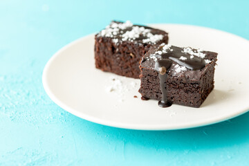 Vegan chocolate brownie on plate close up