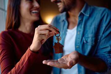 Close up of couple holding keys of their new home.