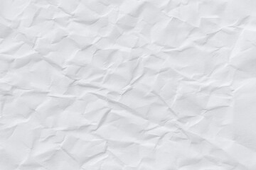 Minimalist white crumpled paper background with soft lighting and subtle wrinkles.