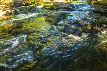 Landscape still shot of the Dure River in Brousse and Villaret in the South of France. Small waterfalls and undergrowth in Occitanie.
