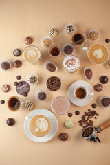 Various coffee drinks with chocolate truffles, beans and milk on beige background. Cozy flat lay for cafes, baristas, dessert menus, social media and coffee branding.