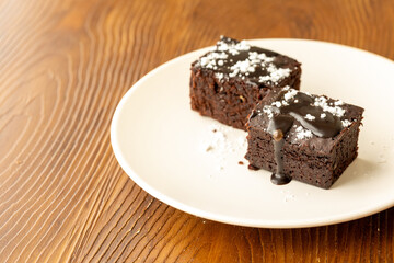 Vegan chocolate brownie on plate close up