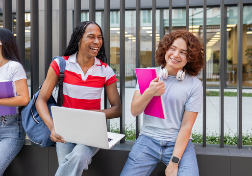 Diverse group of university students with laptop