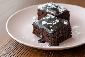 Vegan chocolate brownie on plate close up