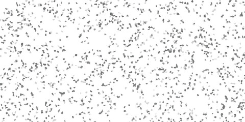 Abstract mosaic background in shades of gray with randomly scattered geometric elements on a white backdrop