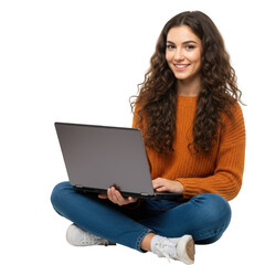 Young woman with curly hair smiling while using a laptop computer sitting cross legged with a bright expression isolated on transparent background