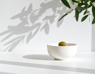Single Olive in White Bowl, Olive Branch Shadow