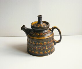 Retro teapot in brown and yellow colors. Design by Jette Helleroe. Denmark. 1970s.