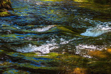 Landscape still shot of the Dure River in Brousse and Villaret in the South of France. Small waterfalls and undergrowth in Occitanie.
