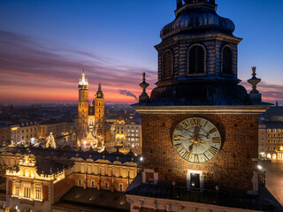 Town Hall Tower and St Marys Church over Main Square in Krakow, Poland, colorful sunrise