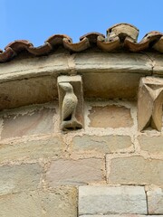 Stone corbels with carved faces in the church of San Esteban de Lomilla, Palencia