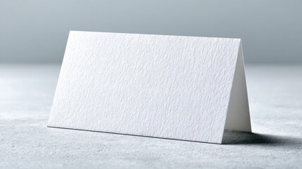 Blank White Tent Card Mockup on a Textured Surface