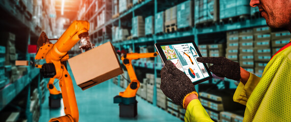 Smart robot arm systems for innovative warehouse and factory digital technology . Automation manufacturing robot controlled by industry engineering using IOT software connected to internet network .