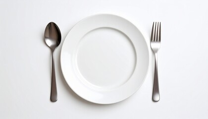 Minimalist table setting with white plate, spoon, and fork on white background.
