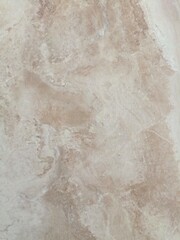 Beige marble texture in a luxurious style in cream and brown colors representing elegance and construction materials with copy space