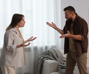 Betrayal. Emotional couple arguing in living room