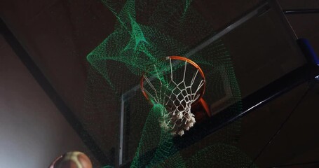 Sports tech hand releasing basketball deforming mesh rim and ball moving through net - Powered by Adobe