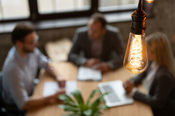 business people meeting in cafe smiling and talking over coffee at table