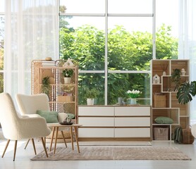 Comfortable armchairs and other furniture in living room. Interior design