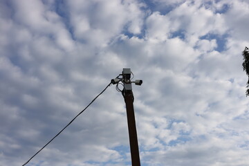 street lamp against blue sky