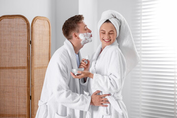 Young couple getting ready together at home