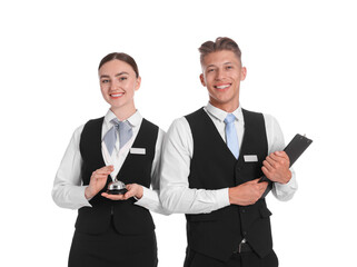 Smiling receptionists in uniforms with service bell and clipboard on white background