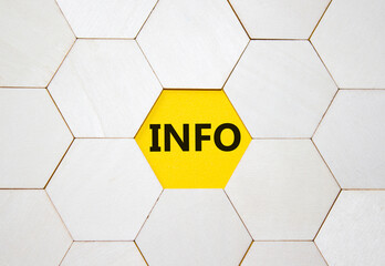 Info symbol. Concept word Info on wooden comb puzzle. Beautiful yellow background. Business and Info concept. Copy space.
