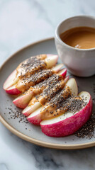 Apple slices with peanut butter and chia seeds, clean snack plate