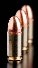 Detailed shot of 9 mm ball ammo on a black background, emphasizing the precision of firearm components 