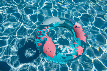 inflatable ring floating in blue pool water