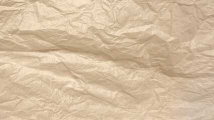 beige crumpled tissue paper texture with soft folds for scrapbooking background or vintage design

