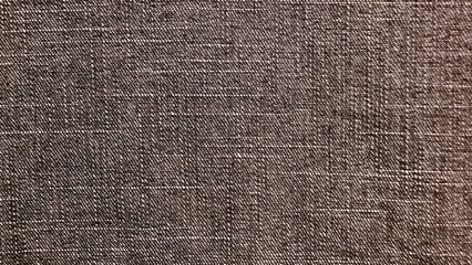 close up of textured brown linen fabric with fine weave detail ideal for upholstery background or...