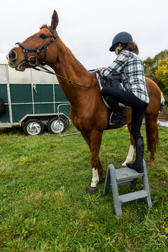 Young teenager bonding with horse in New Zealand countryside