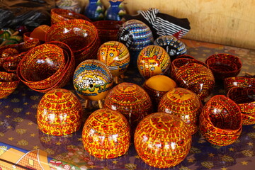 A jícara is a small cup traditionally made from the dried fruit of the calabash tree (Crescentia...