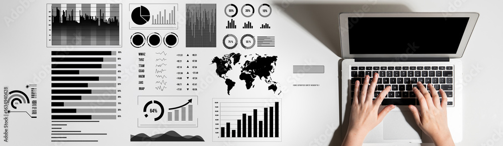 Poster a sleek laptop on a modern desktop surrounded by a variety of charts and graphs, representing data a