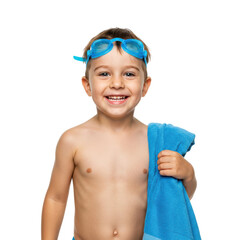 A happy young boy with swimming goggles, holding a blue towel, ready for a swim.