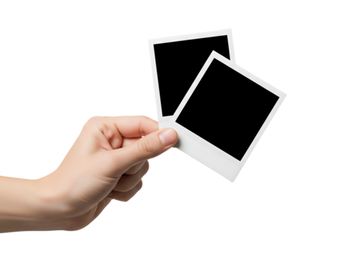 Hand holding two blank polaroid photo frames. Mockup for your picture. Isolated on transparent background, png