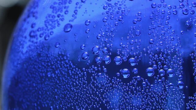 Macro Close up of water bubble inside of a glass bottle 
