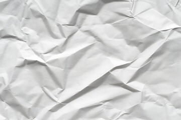 Obraz premium Modern white crumpled paper texture background for creative projects and presentations with unique aesthetic appeal