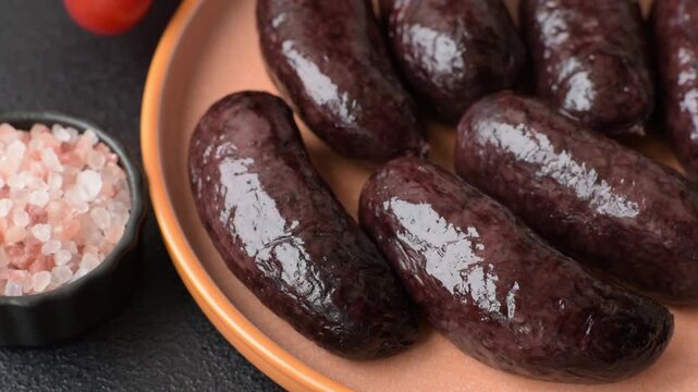 Blood sausage, pudding, meat food with lard and spices. Blood sausage cooked on the grill for dinner
