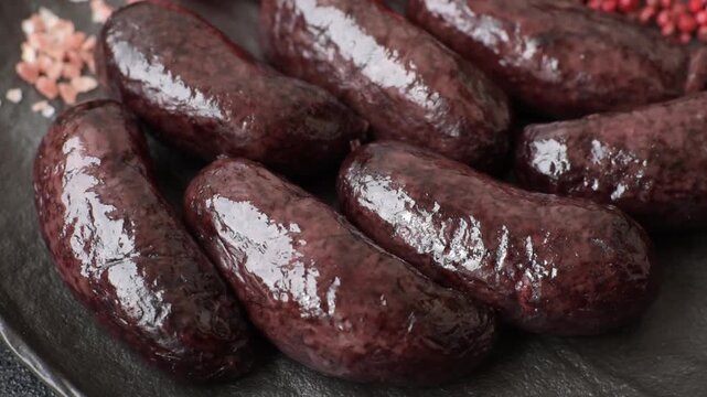 Blood sausage, pudding, meat food with lard and spices. Blood sausage cooked on the grill for dinner
