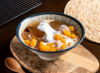 Taiwanese Brown Sugar Aiyu Taro Balls Iced Dessert in bowl side view of taiwan food